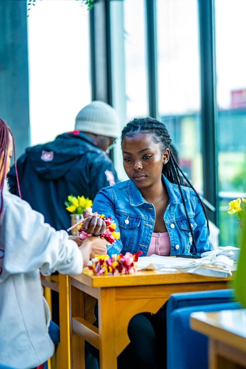 Guests at the AM Beats activation wearing Florence wrist corsages
